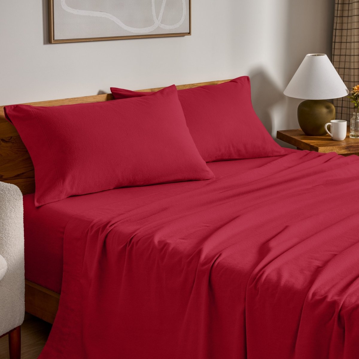 Flannel bed sheets and pillowcases on a bed in a bedroom setting.