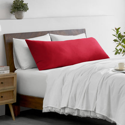 Bed with microfiber bedding and wooden headboard in a bedroom setting