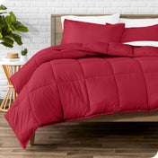 A modern bed with a down alternative comforter set on it