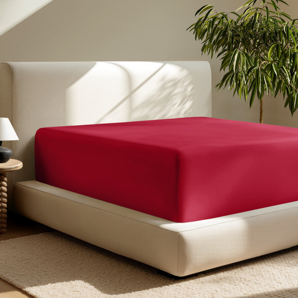 A deep pocket fitted sheet on a mattress