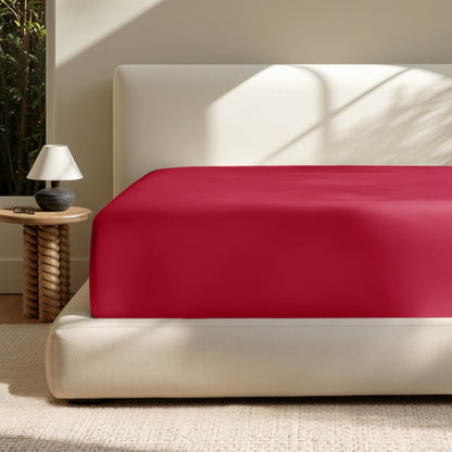 A deep pocket mattress with a fitted sheet on it