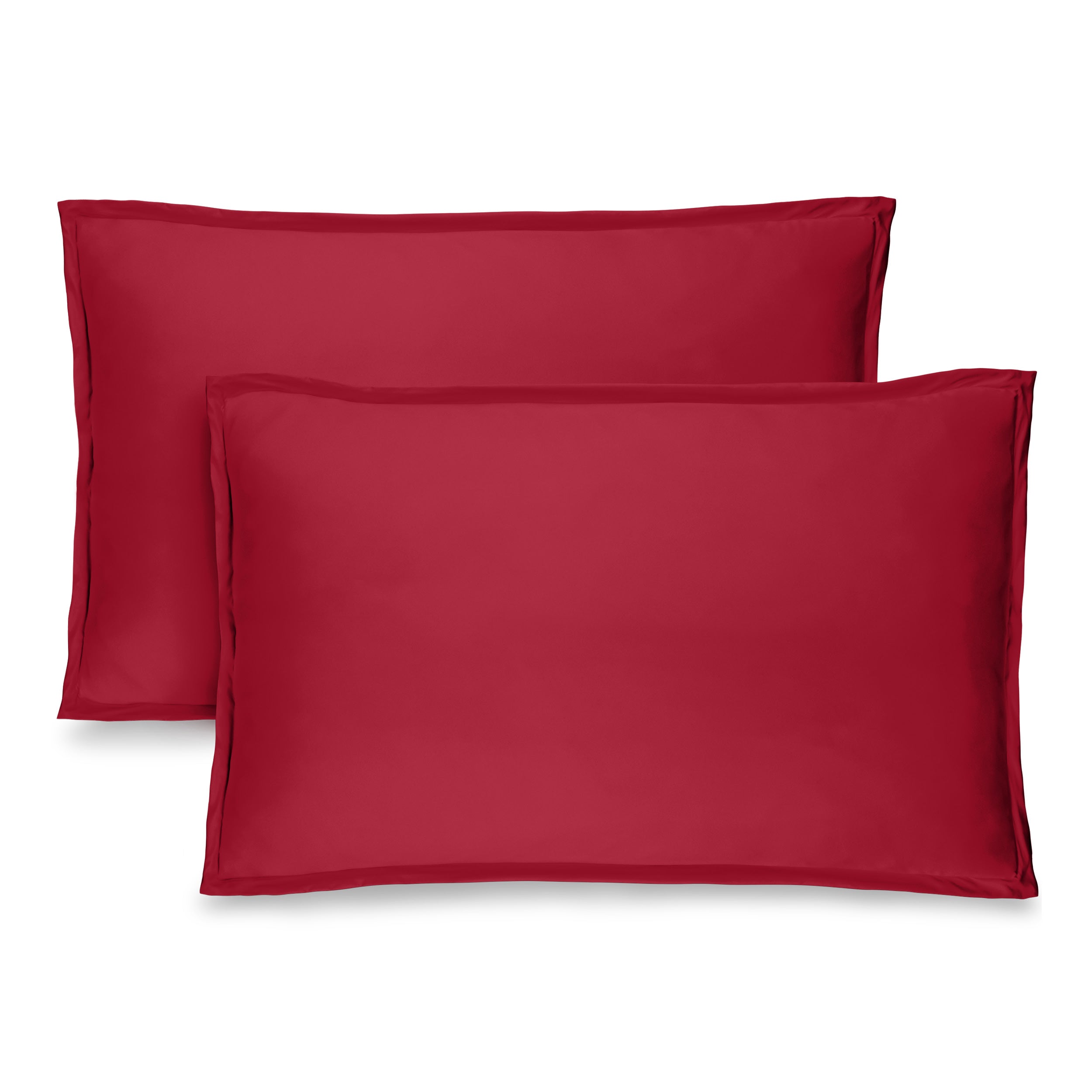 Two red pillow shams on pillows standing up with one behind the other