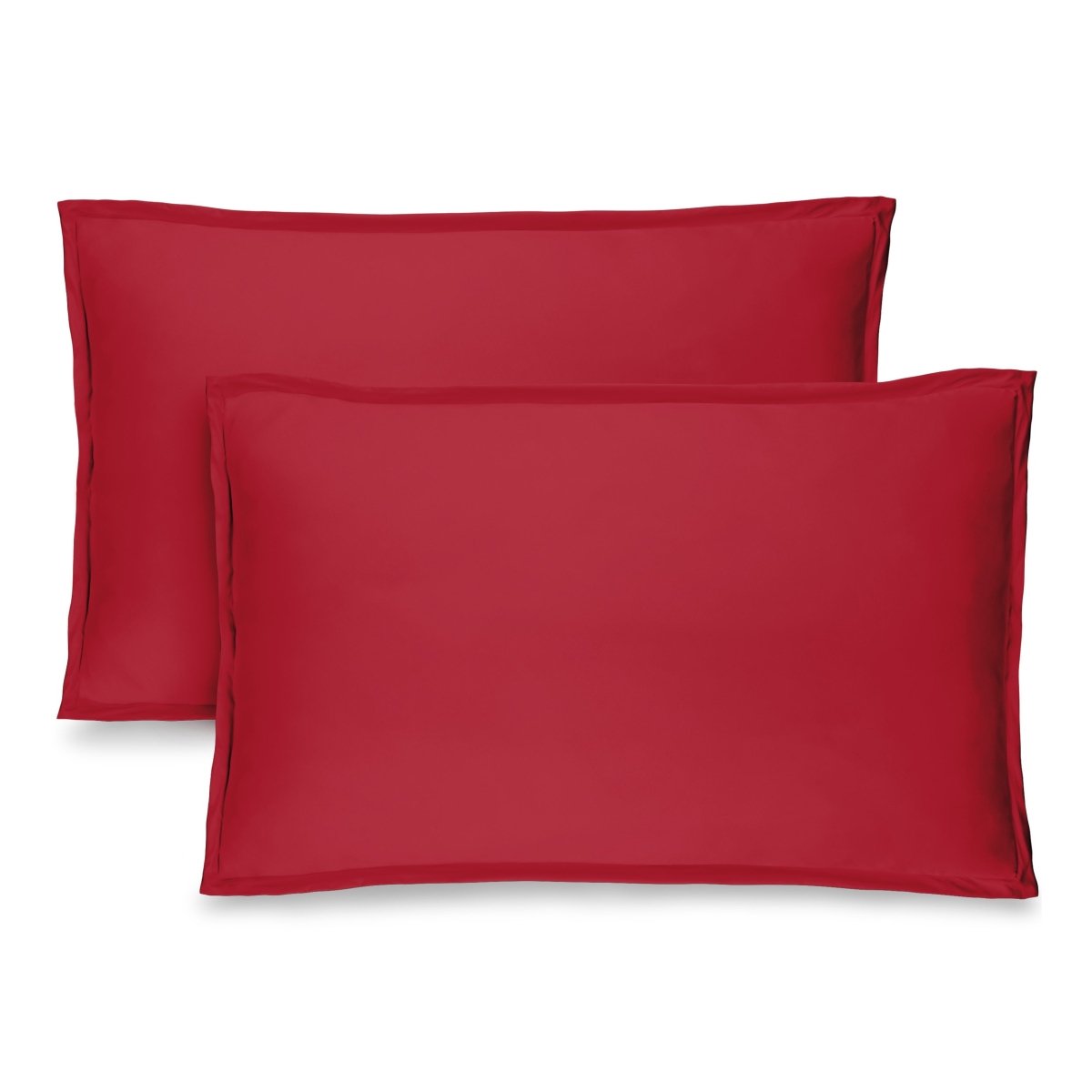 Two red pillow shams on pillows standing up with one behind the other