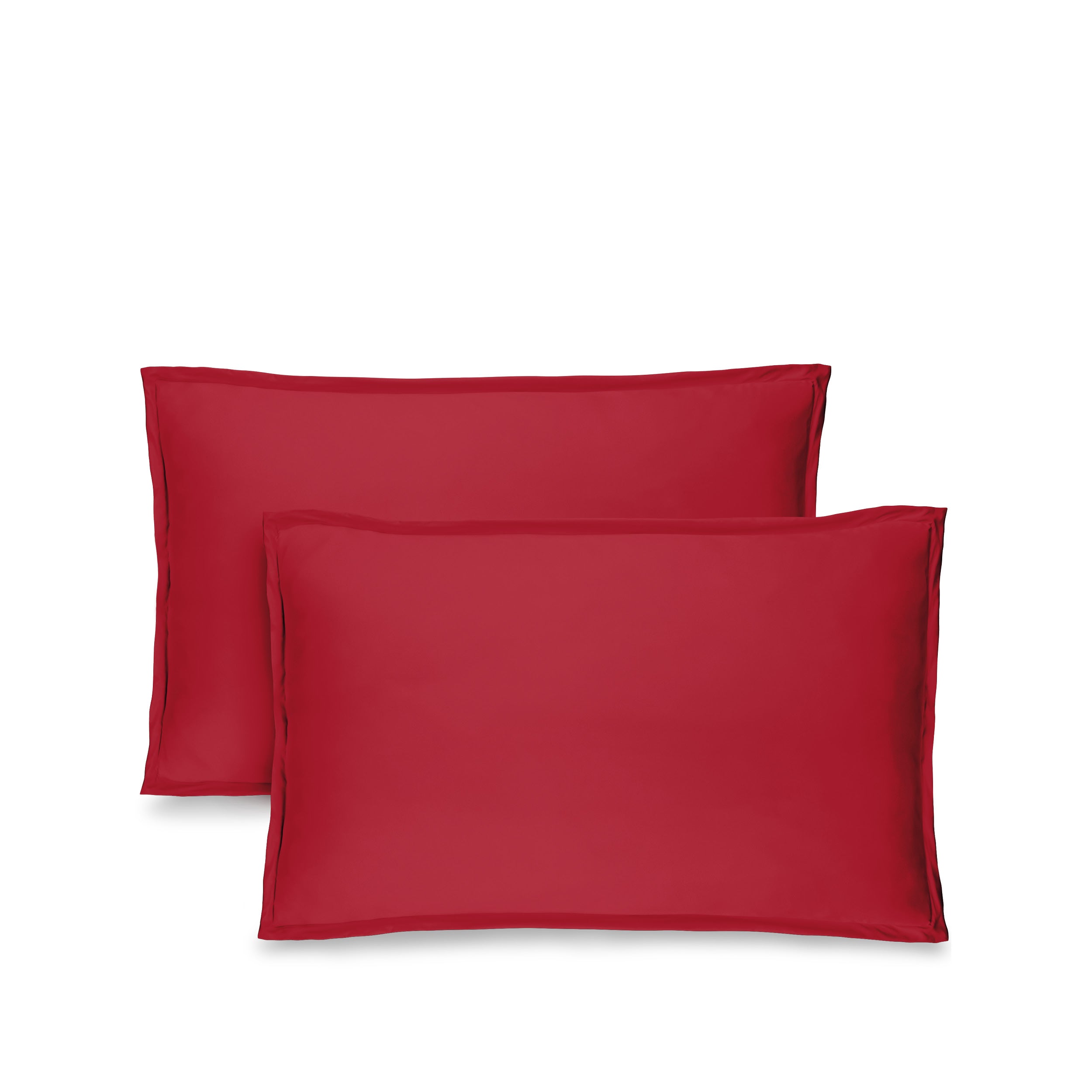 Two red pillow shams on pillows standing up with one behind the other