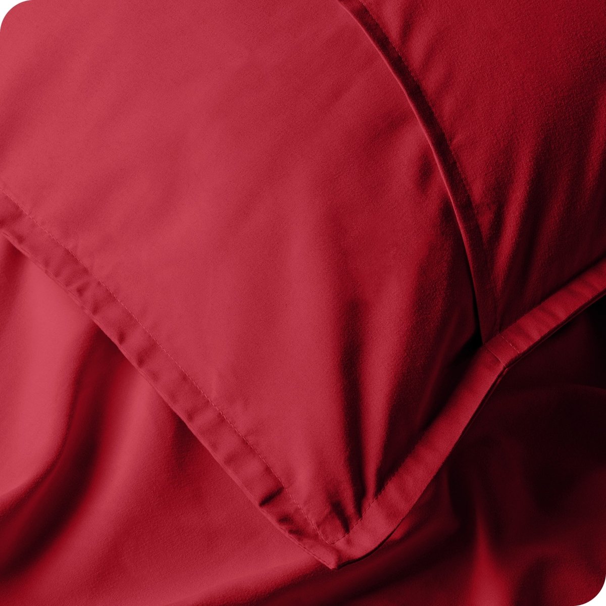 Close up of pillow shams on a bed