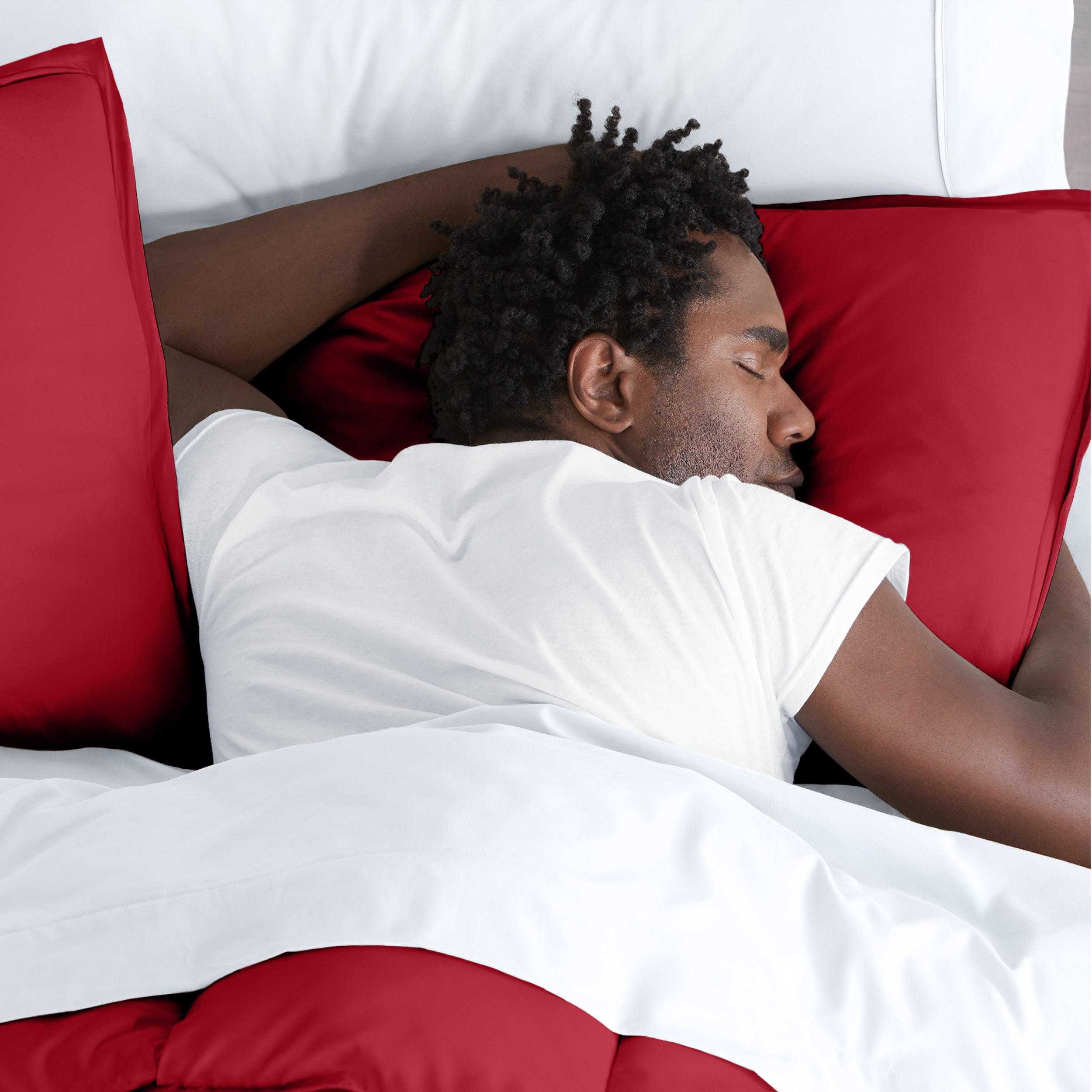 Man sleeping on a bed with microfiber bedding