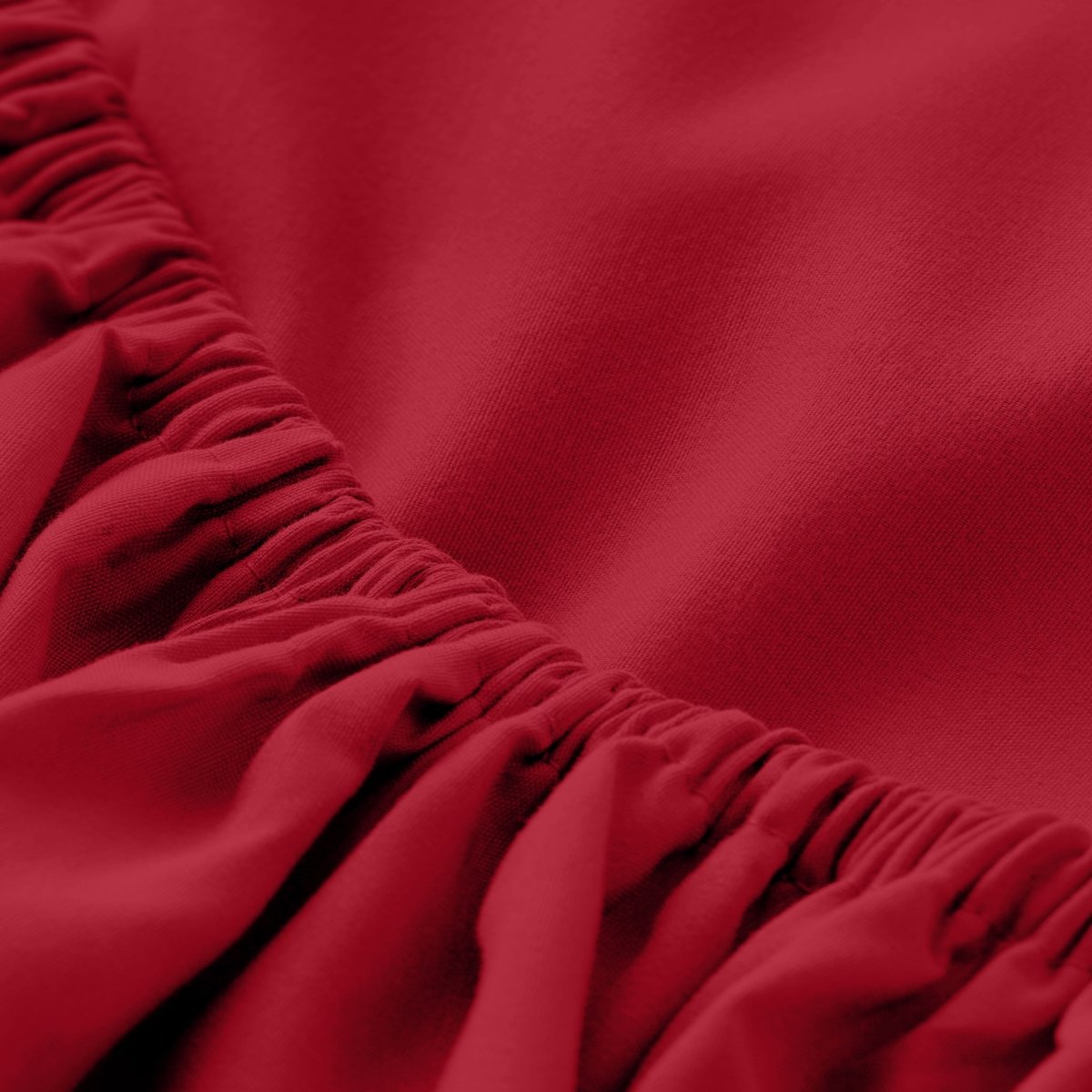 A close-up of a fitted sheet with elasticized edge.