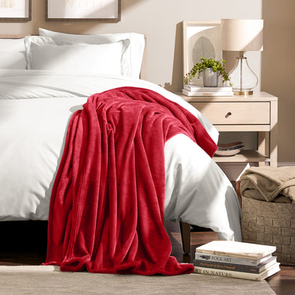 Microplush blanket draped over the corner of a bed
