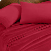 A sheet set and matching pillowcases on a bed.