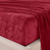 Close-up of the corner of a bed made with microplush sheets