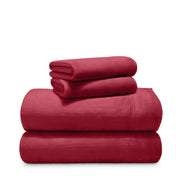 Stack of microplush sheets on a white background