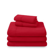 Polar fleece sheets and pillowcases folded and stacked on a white background