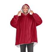 An adult with a sherpa wearable blanket on