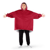 An adult with a sherpa wearable blanket on