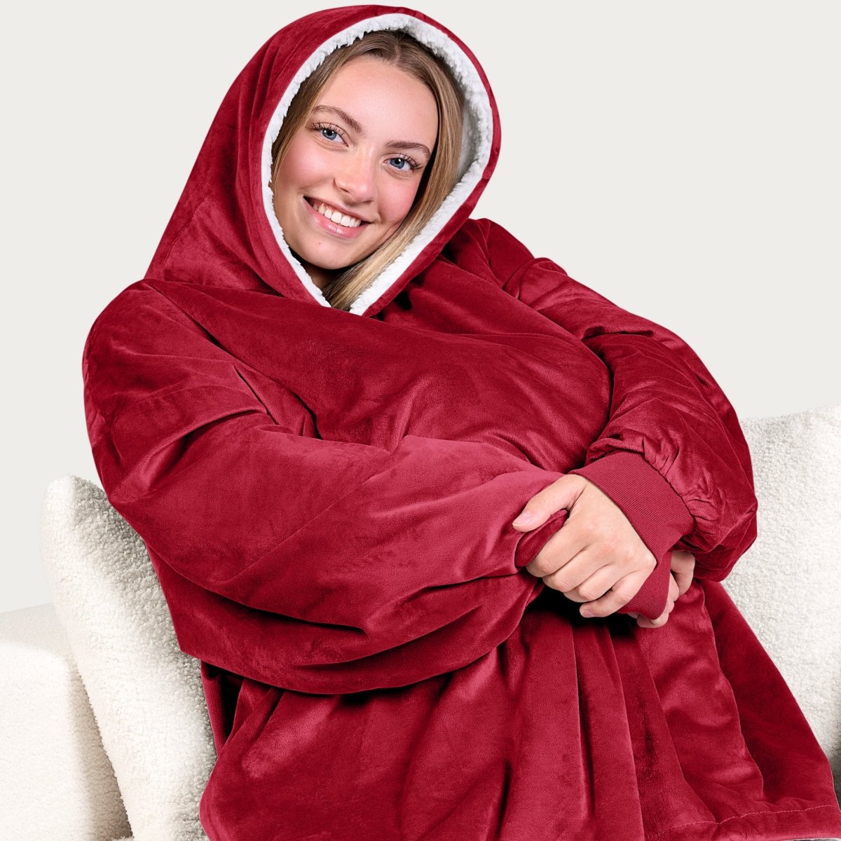 An adult with a sherpa wearable blanket on