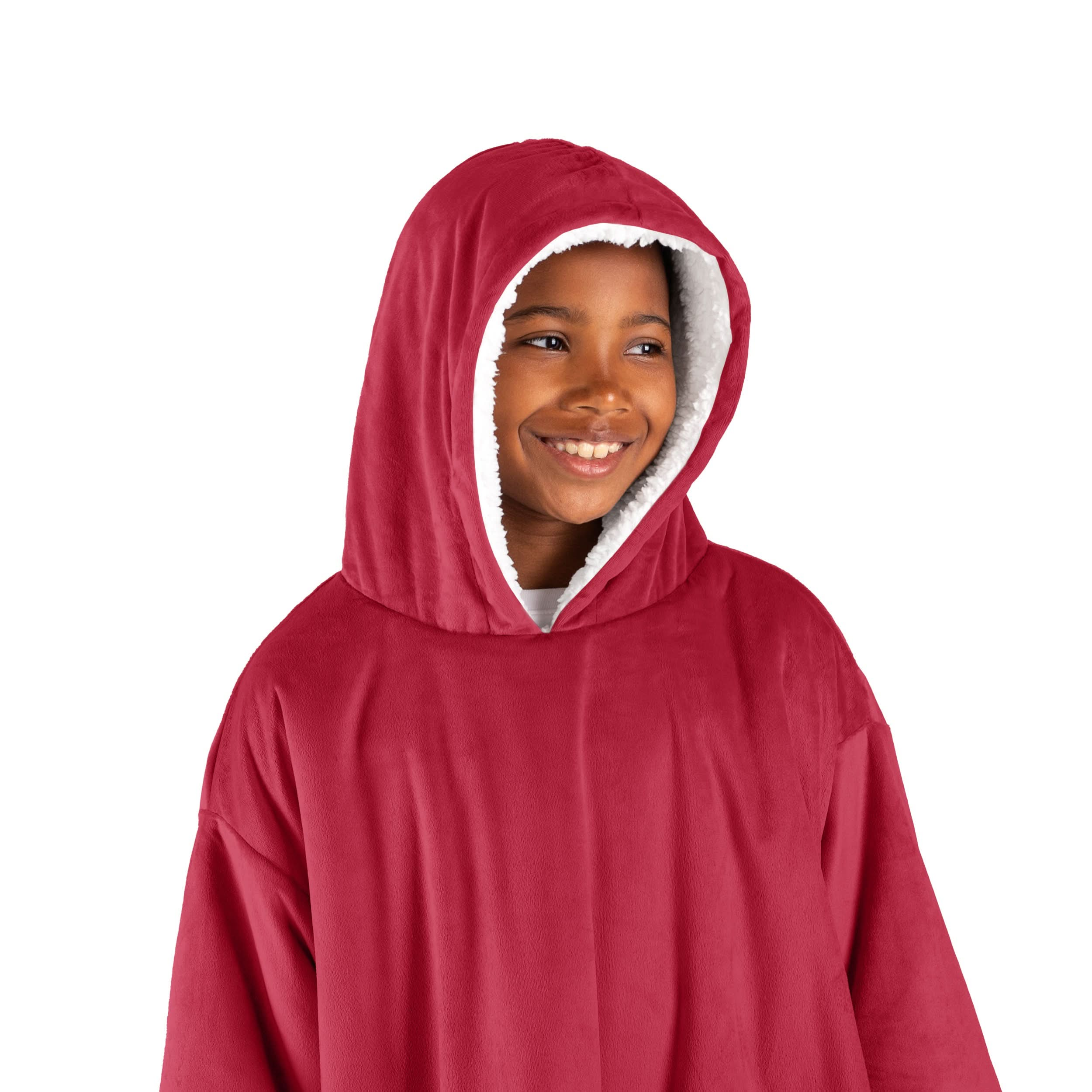 A boy with a wearable blanket on