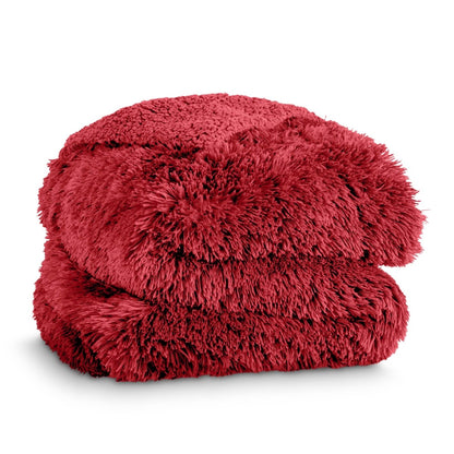 A shaggy faux fur blanket folded neatly