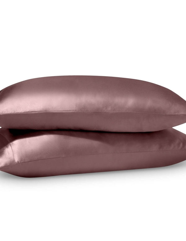 2 satin pillowcases on pillows stacked