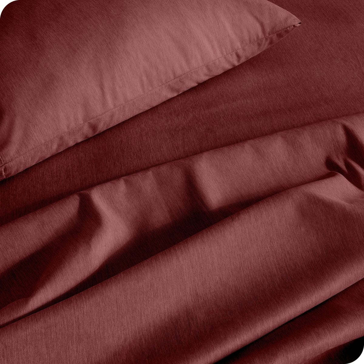Close up of a heather sheet set on a bed