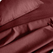 Close up of a heather sheet set on a bed