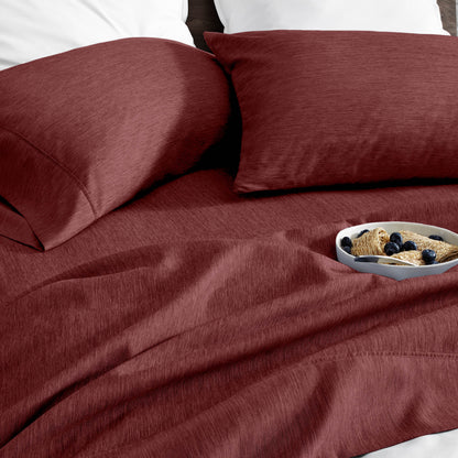 Ultra soft sheet set with a bowl of food on a bed