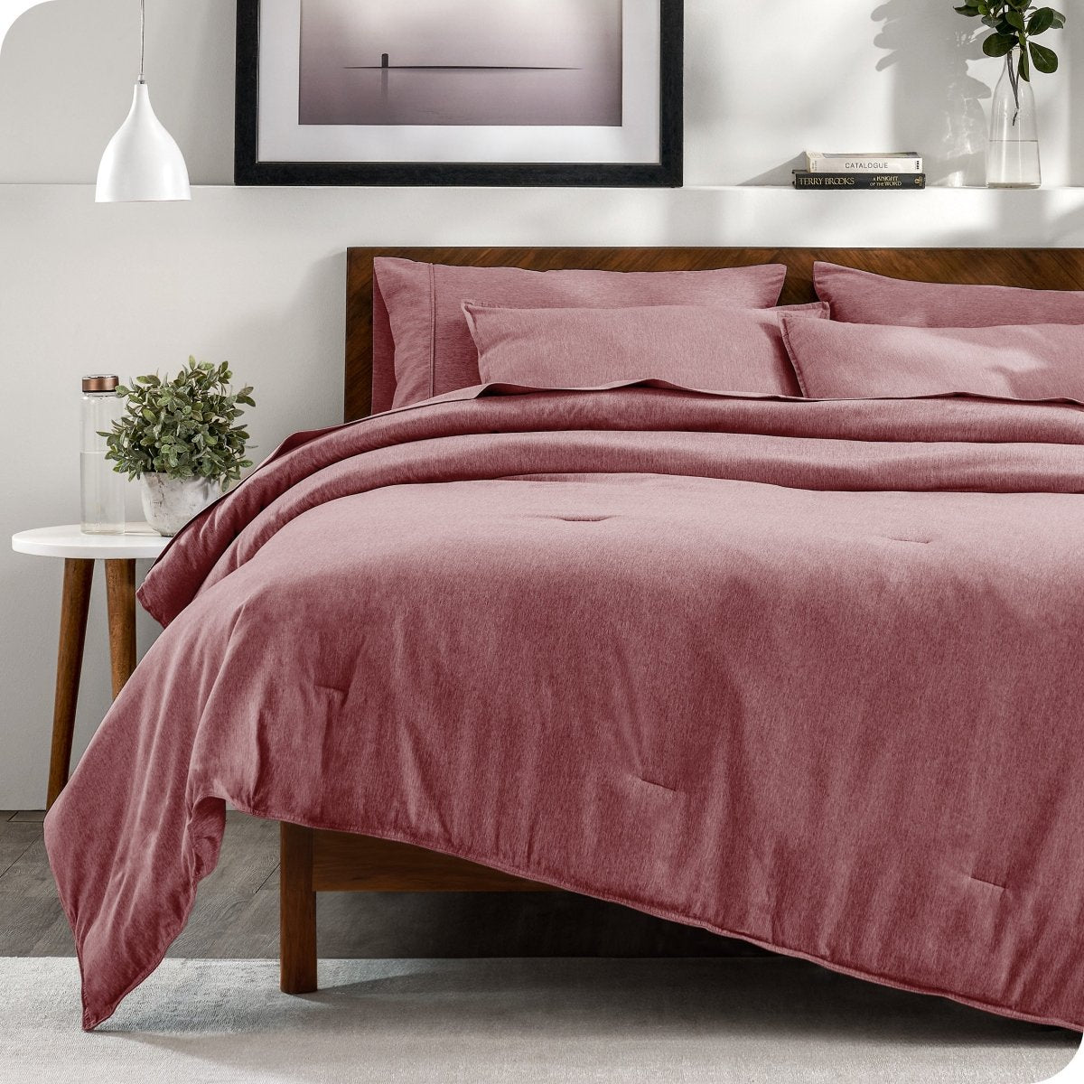 Modern bedroom with a heathered complete bedding set on the bed