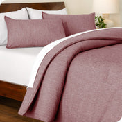 A comforter set on a bed