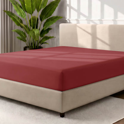 Ultra soft fitted sheet on a mattress with the sun shining into the bedroom