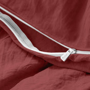 Close-up of a duvet cover with a zipper, featuring the brand Bare Home