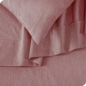 Close up of a heather sheet set on a bed