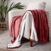 Blanket draped over a chair in a cozy living room setting.