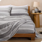Microfiber print sheets draped over a bed
