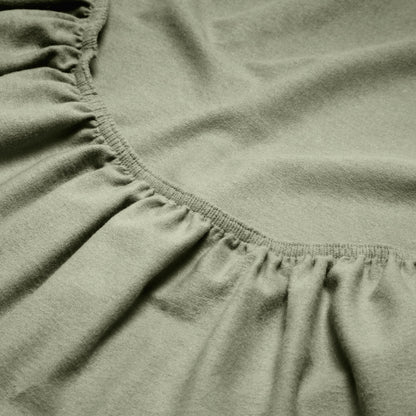 Close-up of a flannel fitted sheet with gathered elastic