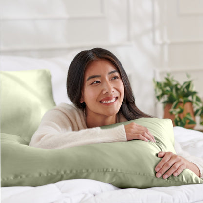 Woman lying on abed with a silk pillowcase