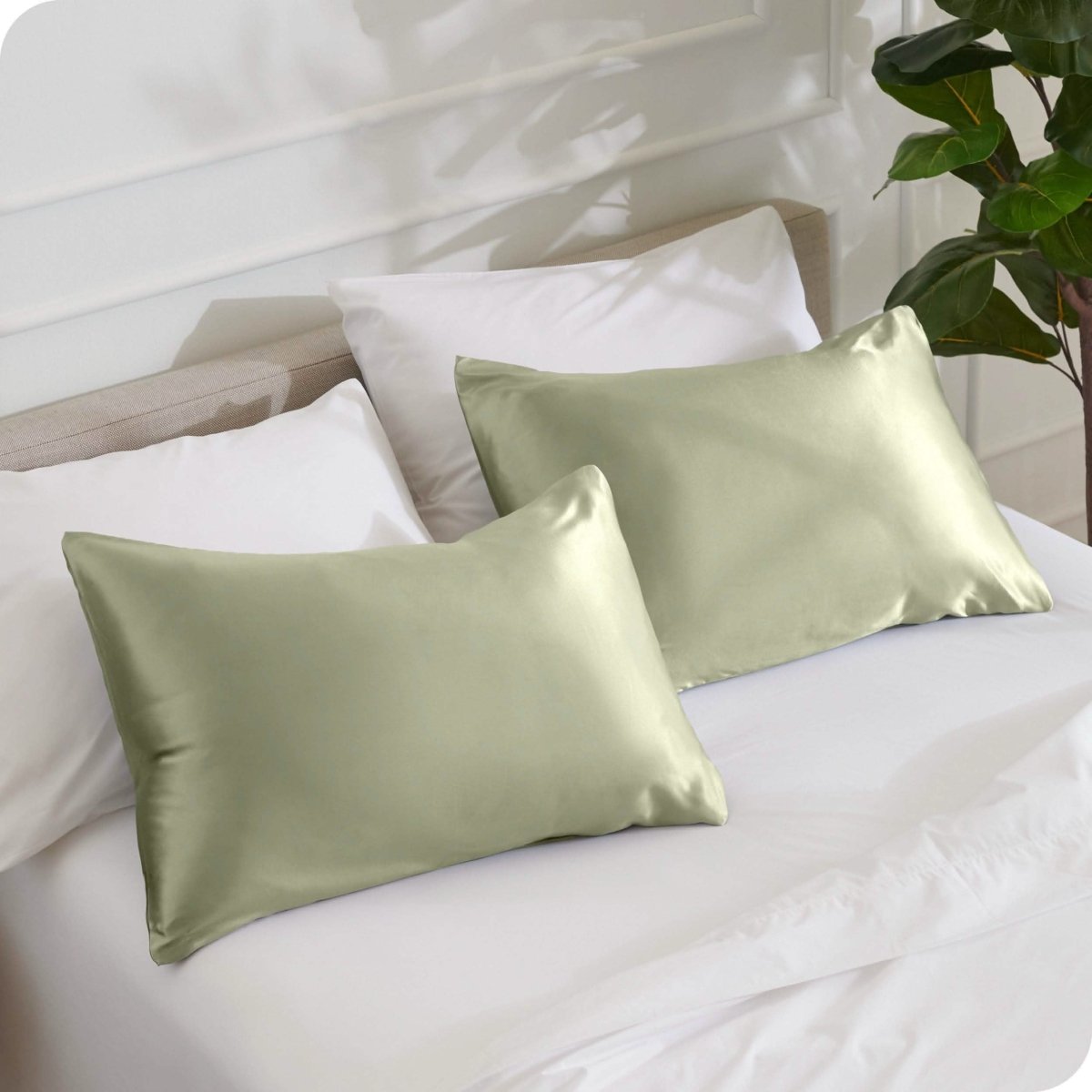 2 mulberry silk pillowcases on pillows set on a bed