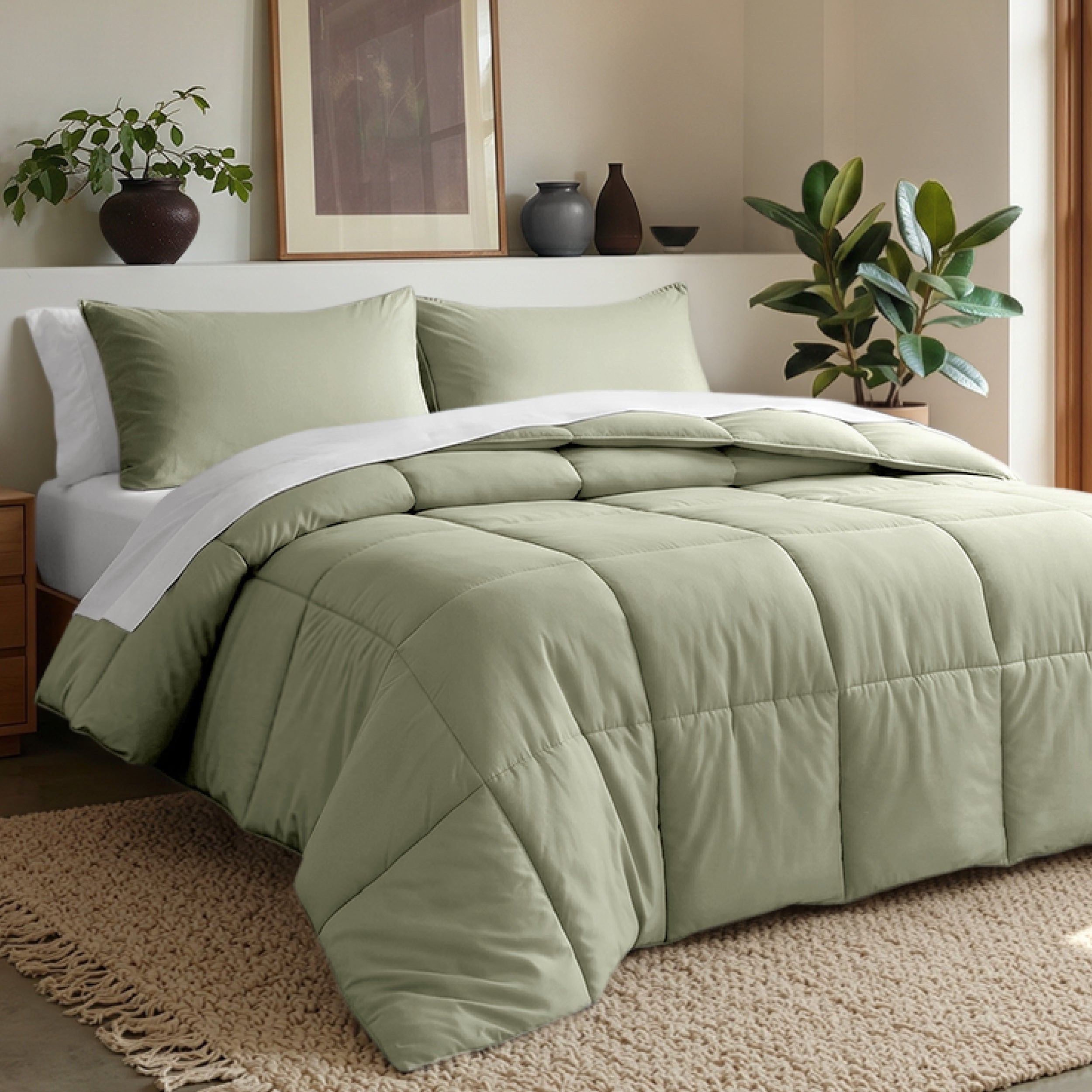 Comforter set on a bed in a bedroom with plants and decor.