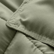 Close-up of comforter fabric with stitching detail
