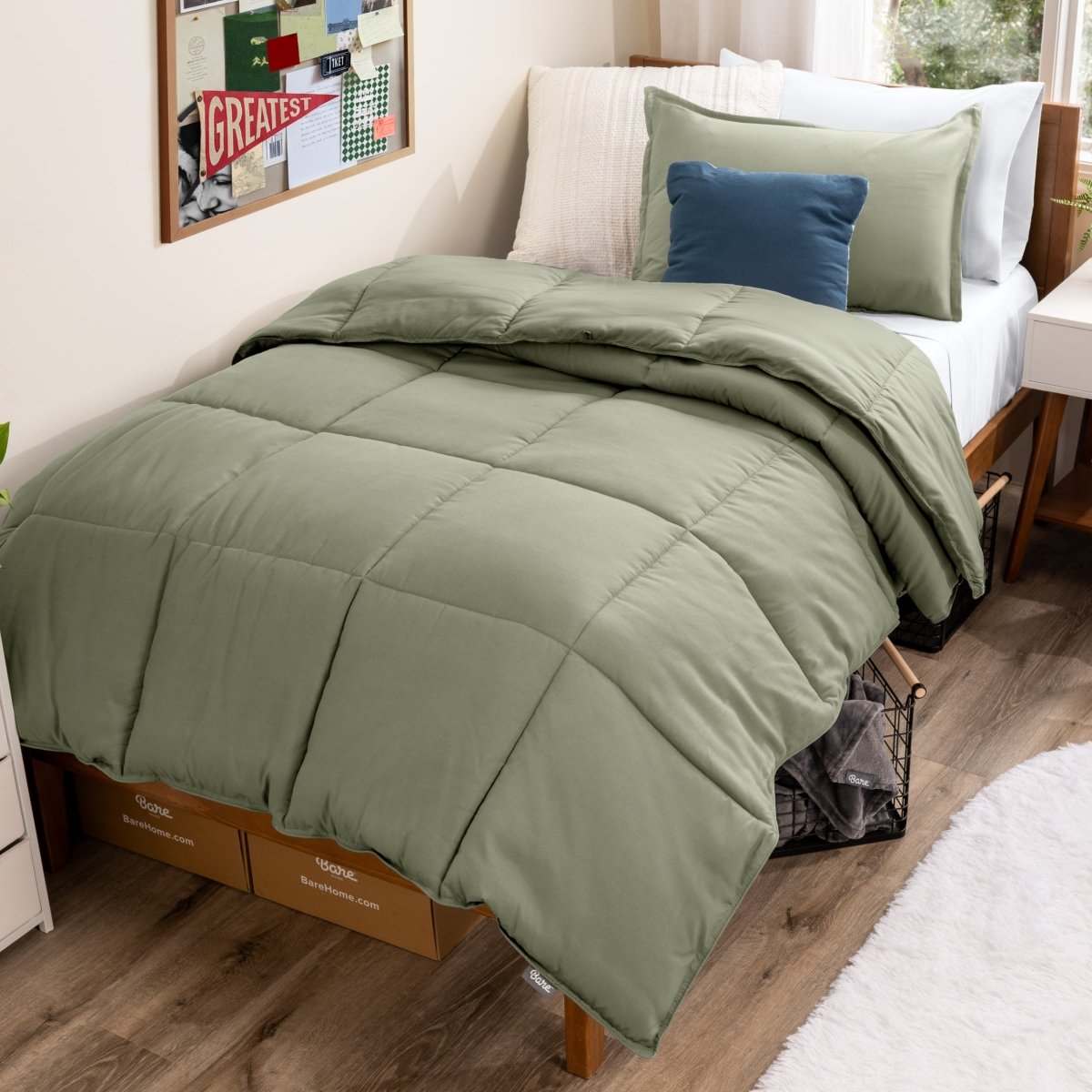 Bed with comforter and pillows in a dorm room