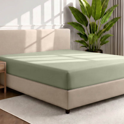Ultra soft fitted sheet on a mattress with the sun shining into the bedroom