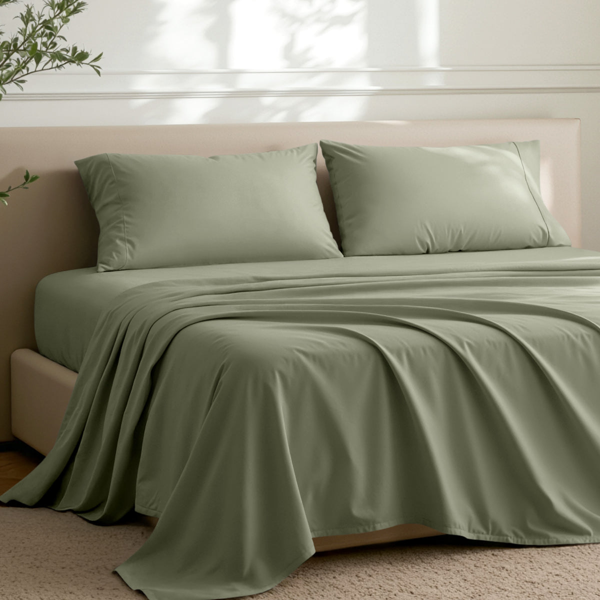 Microfiber sheets on a bed in a well-lit room with a plant.