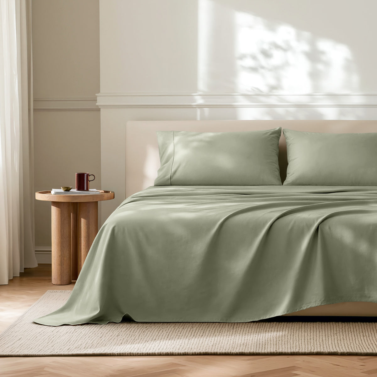 Neatly made bed with microfiber bedding in a bright bedroom.