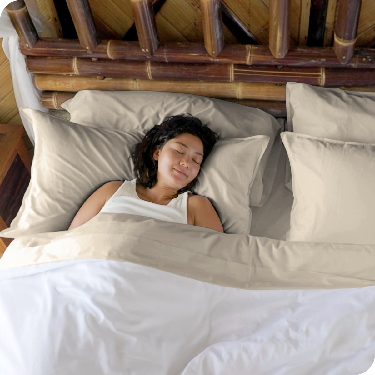 A woman sleeping in a bed made with bamboo sheets