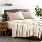 A stylish bed with bamboo sheets and pillowcases, showcasing a sophisticated and elegant bedroom setting.