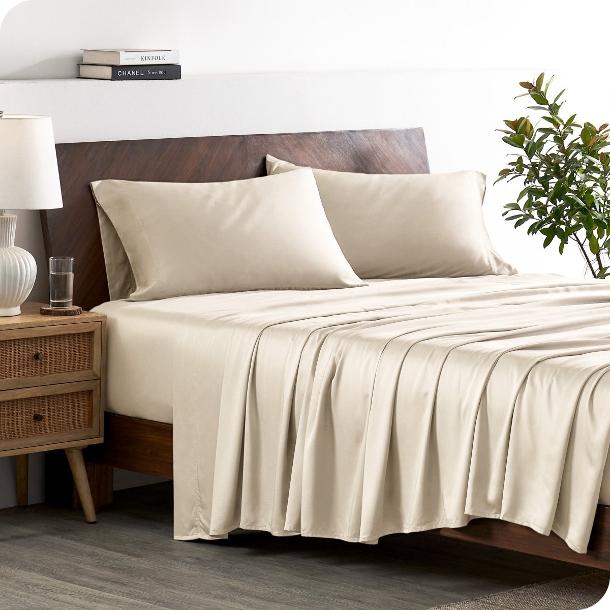 A stylish bed with bamboo sheets and pillowcases, showcasing a sophisticated and elegant bedroom setting.