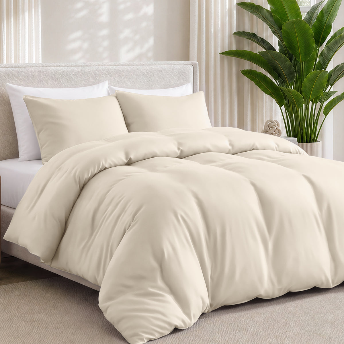 Bamboo bedding set on a bed in a bedroom with a plant in the corner.