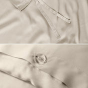 Close-up of the corner ties and button closure on a duvet cover