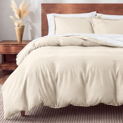 Flannel bedding set on a bed in a bedroom with a nightstand and lamp.