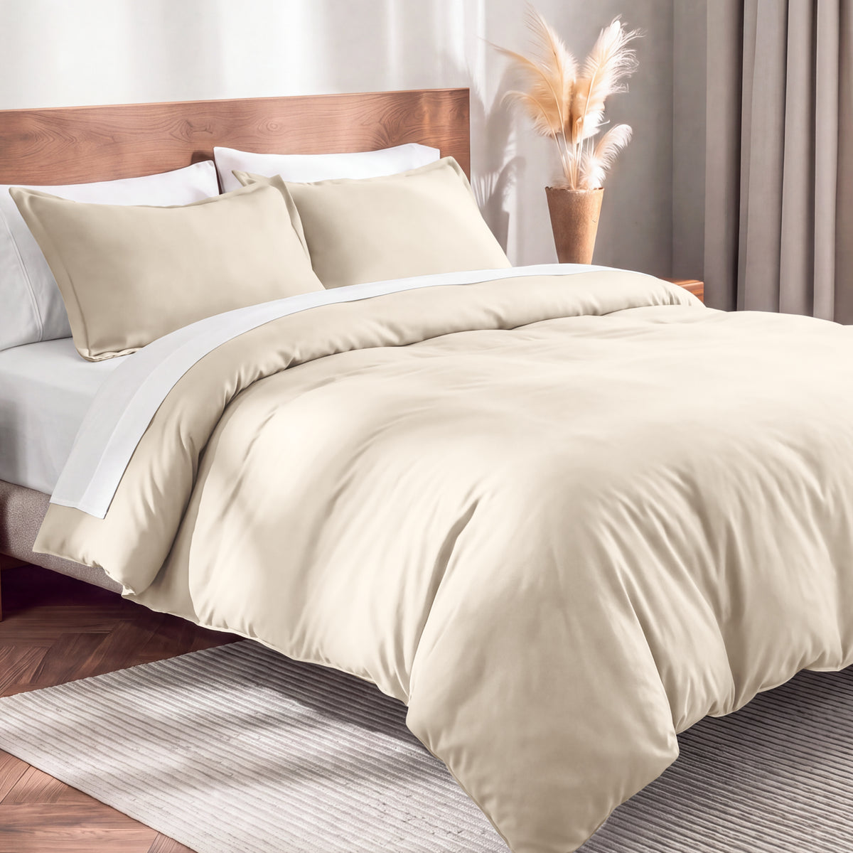 Flannel duvet cover set on a bed in a bedroom with a lamp and plant in the background.