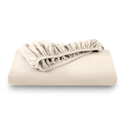 A folded flannel cotton fitted sheet in a white background