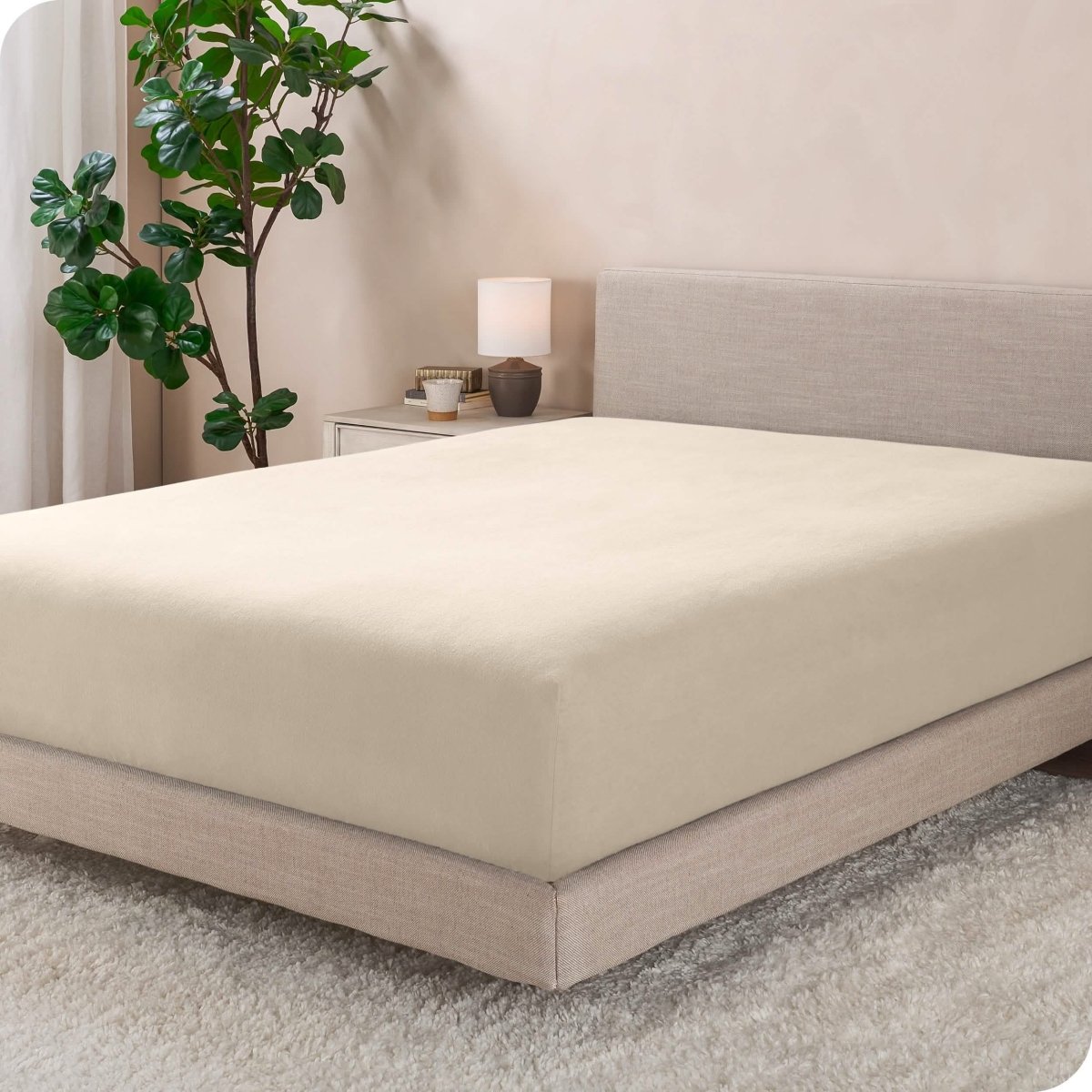 A modern bed with a flannel fitted sheet on
